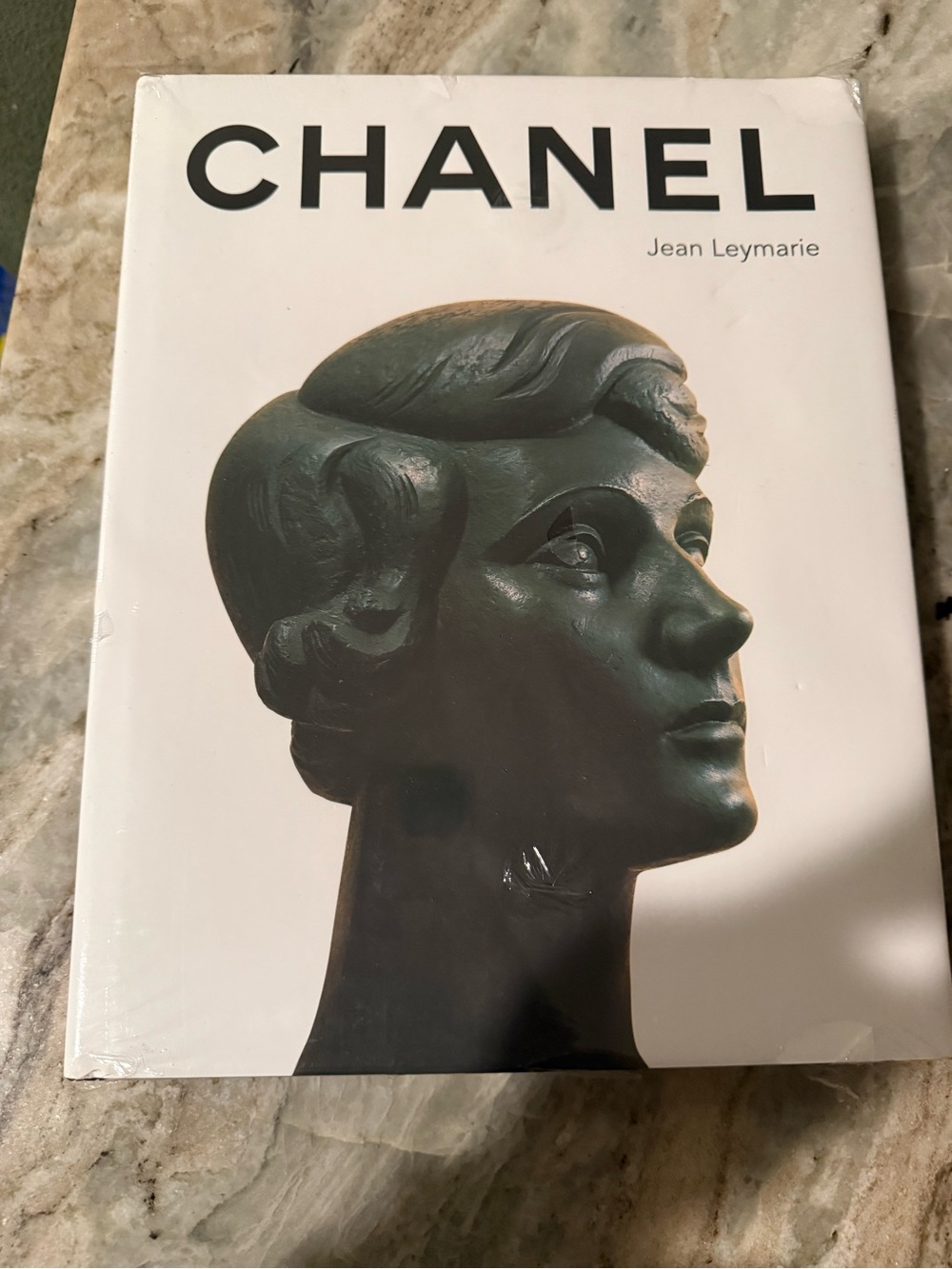 CHANEL White Cover Book with Dark Green Sculpted Bust